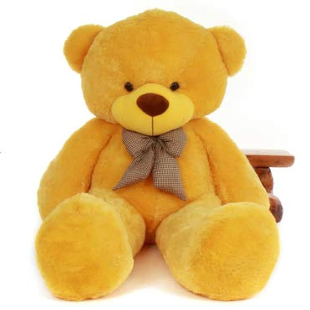 Yellow teddy bear with a brown bow on a white background